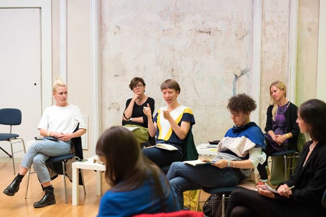 Group of people discussing in a circle