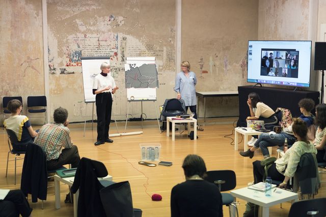 Group of people watching a presentation