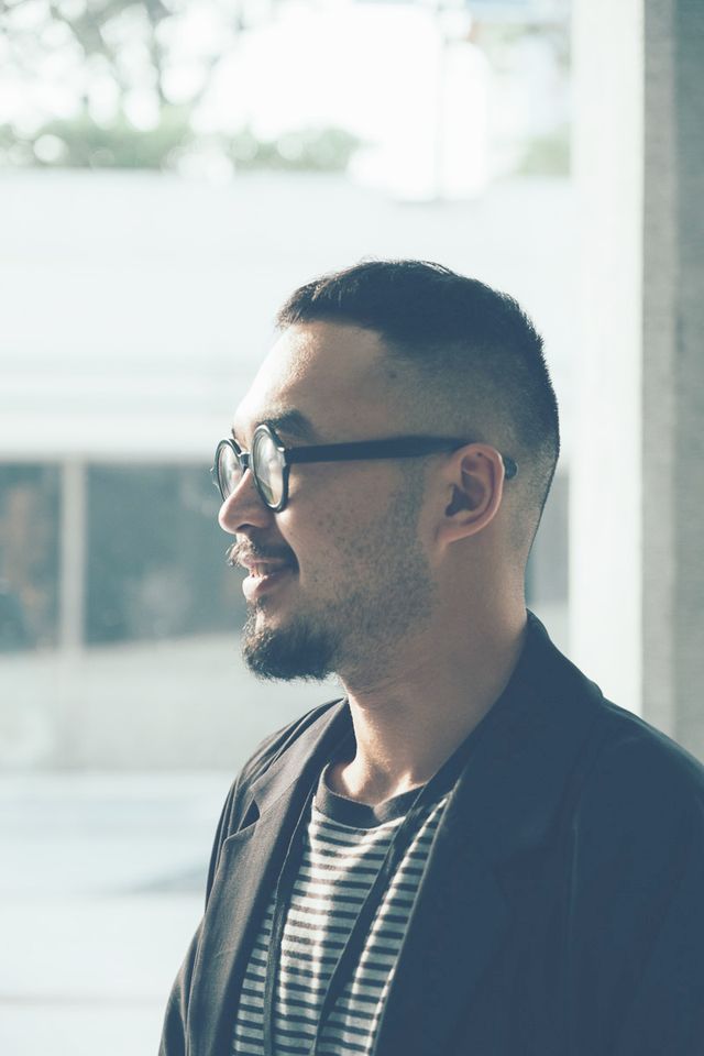 Profile of River Lin wearing glasses and smiling