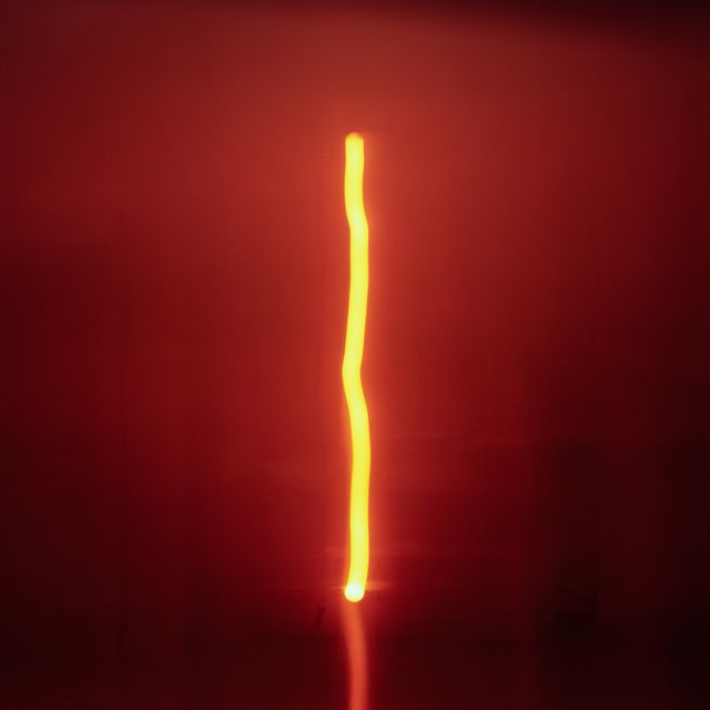 Vertical yellow light stripe in red environment